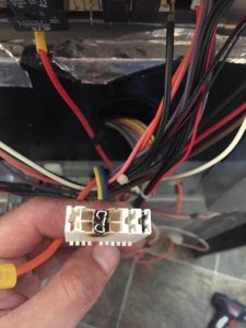 Our appliance repair team taking apart a home fridge - Appliance Repair Service
