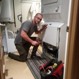 One of our team members repairing a home appliance.